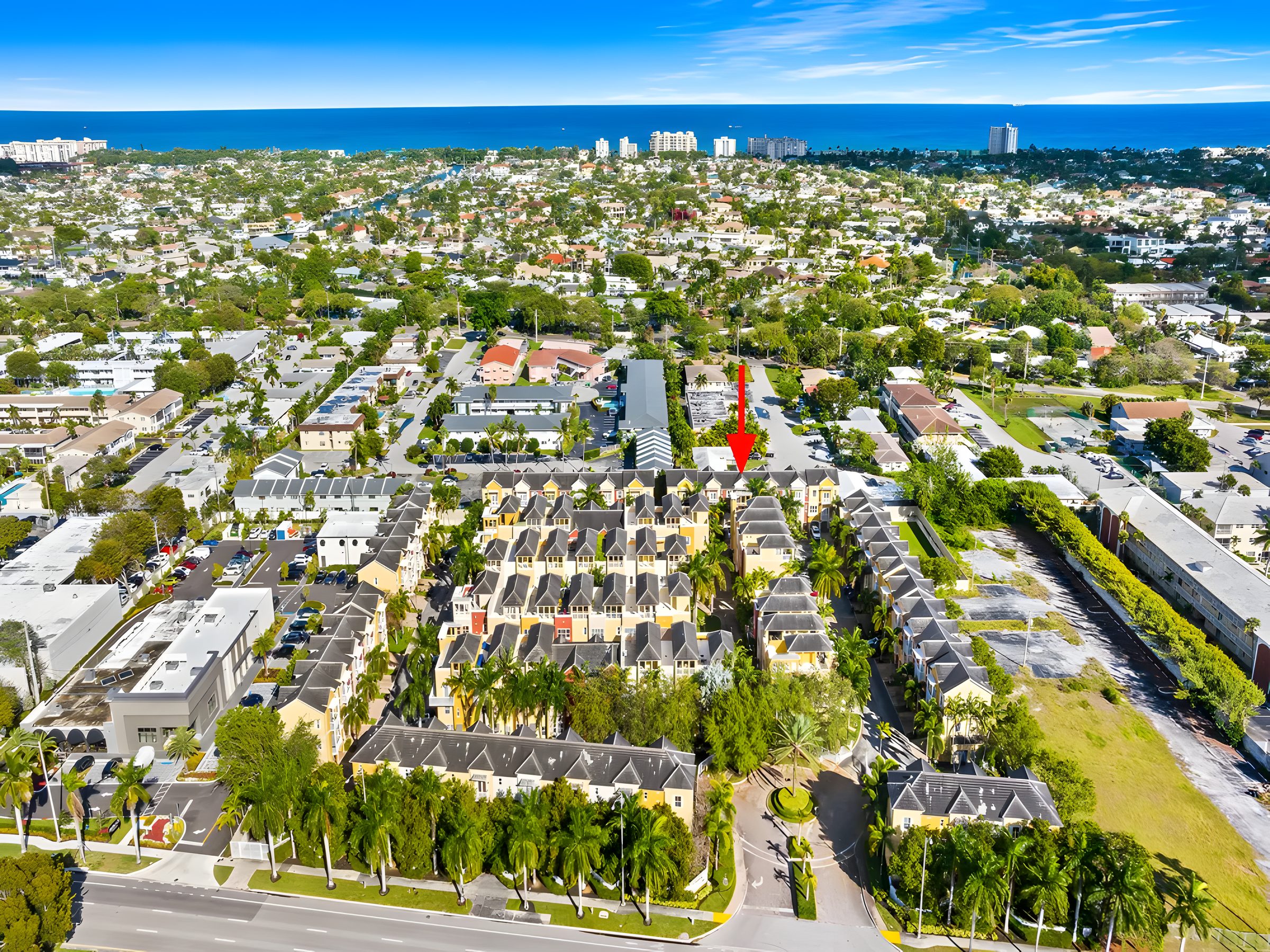 Aerial view of Vintage at Lighthouse Point with the Atlantic Ocean on the horizon.